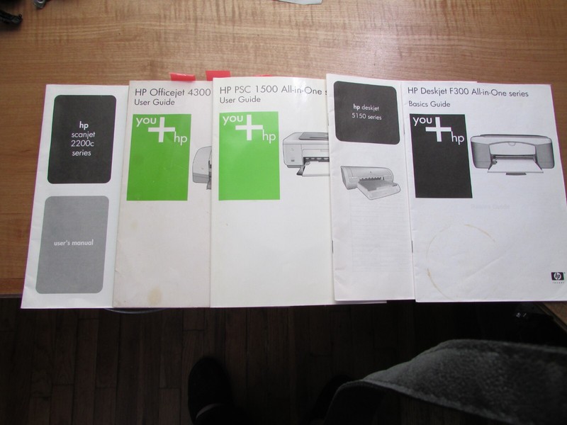 Set of five used user guides for HP printers.