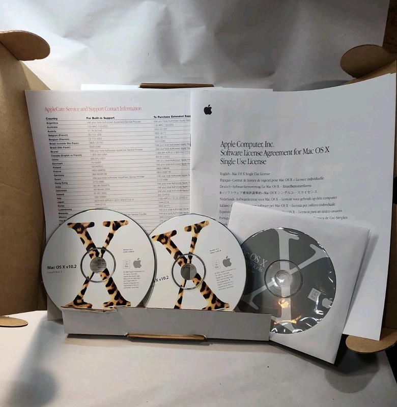 Mac OS X 10.2 Jaguar install discs + developer tools disc and Mac OS X manual gallery