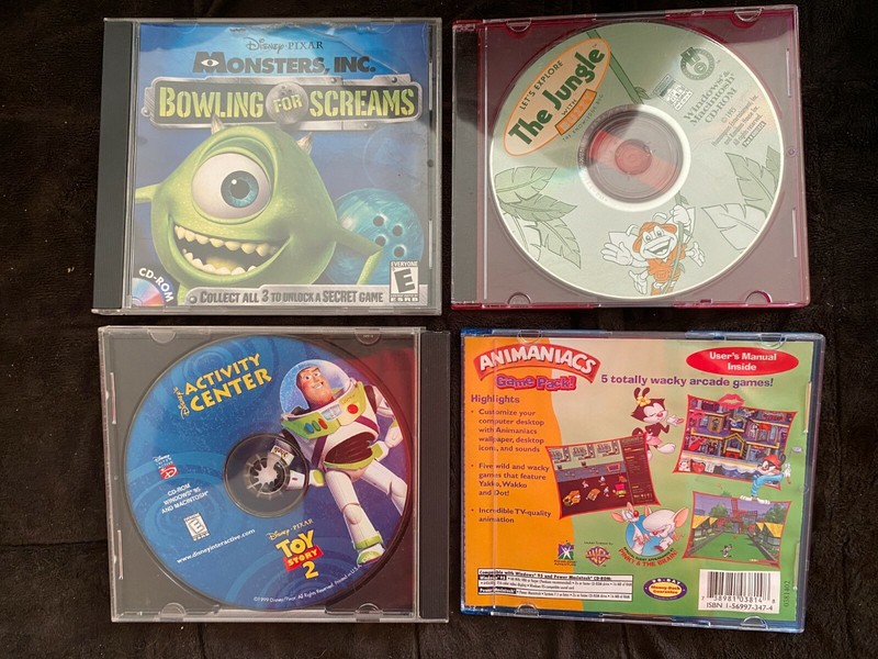 4 CD-ROM Games 1995-2001: Toy Story 2, Monsters, Inc., Animaniacs, Buzzy Bug