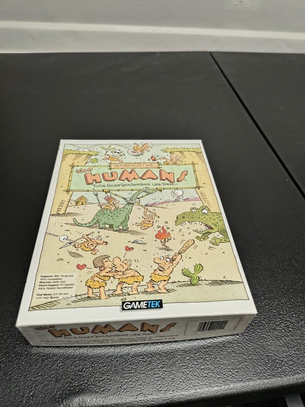 the Humans! IBM PC Game on 5.25″ disks with big box and poster
