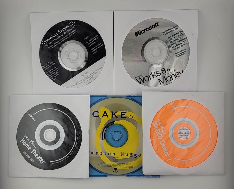 Windows XP SP2 CD – Microsoft Works – Windvd Creator & Home Theater – Cake Cd