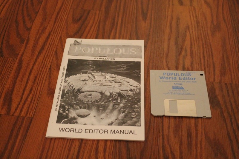 Populous World Edition Commodore Amiga program on 3.5″ disk with manual